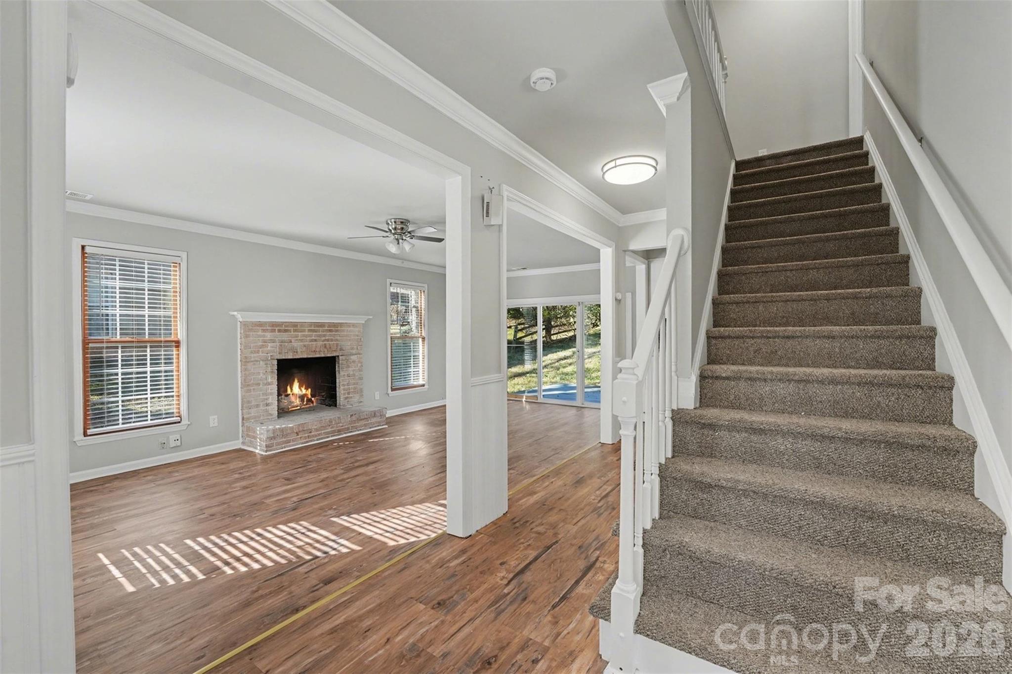 1635 Bear Mountain Road Charlotte, NC 28214 - Photo 11 of 27 a view of an entryway with wooden floor and a fireplace