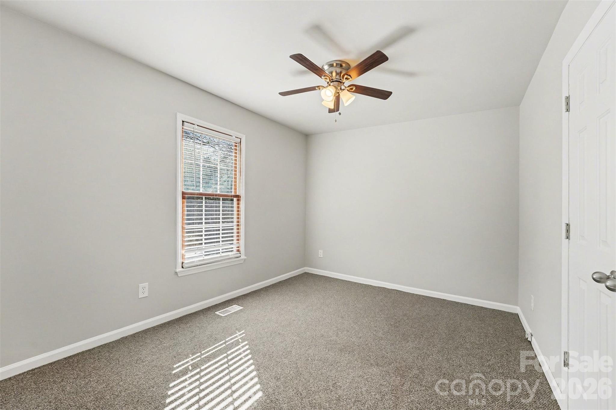 1635 Bear Mountain Road Charlotte, NC 28214 - Photo 17 of 27 a view of an empty room with a window