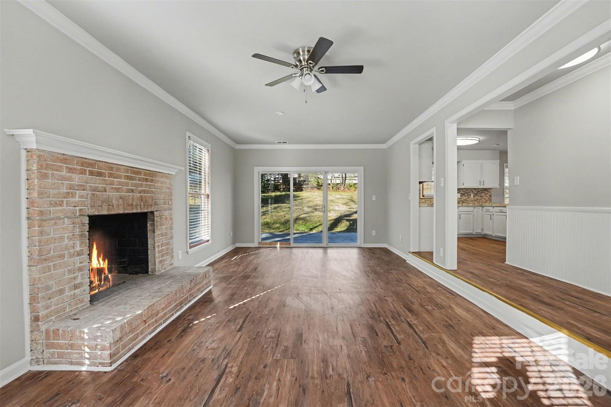 1635 Bear Mountain Road Charlotte, NC 28214 - Photo 2 of 27 a view of main area fire place window and wooden floor