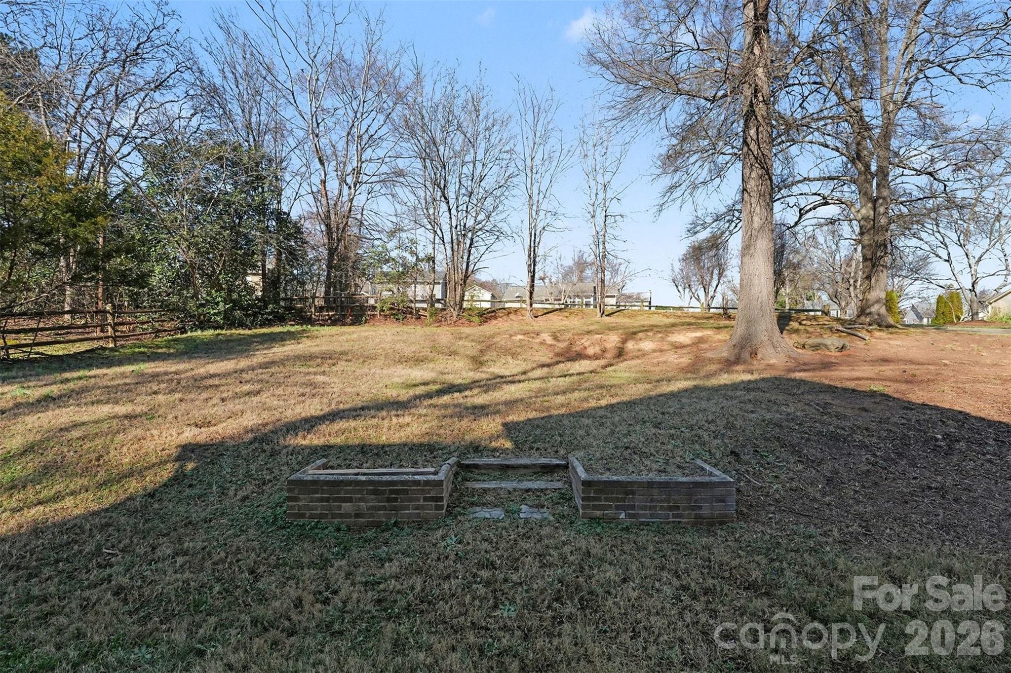 1635 Bear Mountain Road Charlotte, NC 28214 - Photo 27 of 27 a view of dirt yard with a large tree