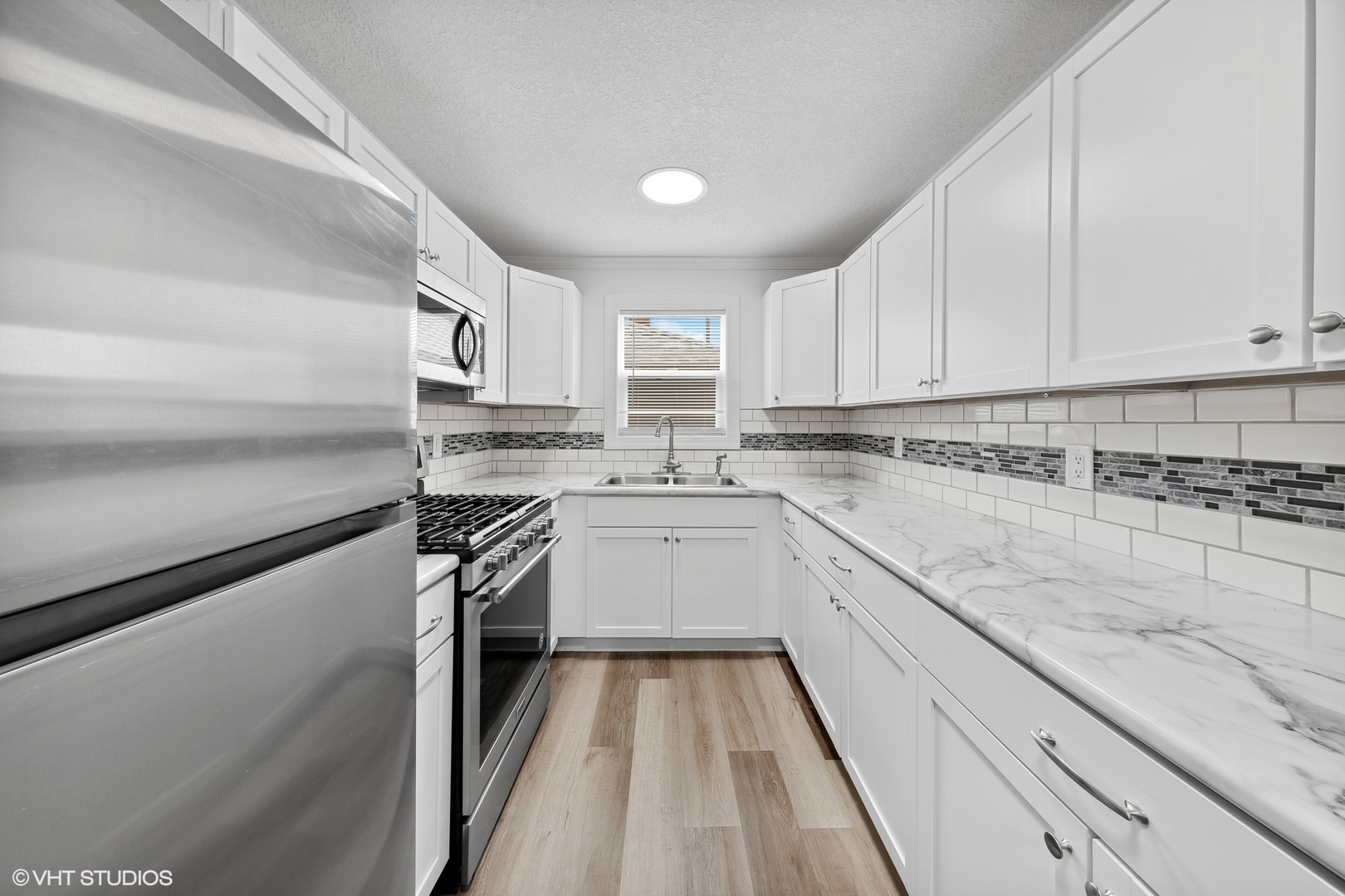 609 West Park Drive Kankakee, IL 60901 - Photo 7 of 19 a kitchen with a sink stove top oven and cabinets