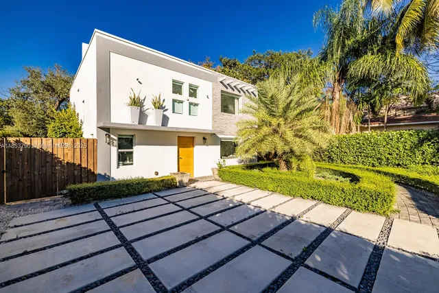 a view of a backyard with sitting area