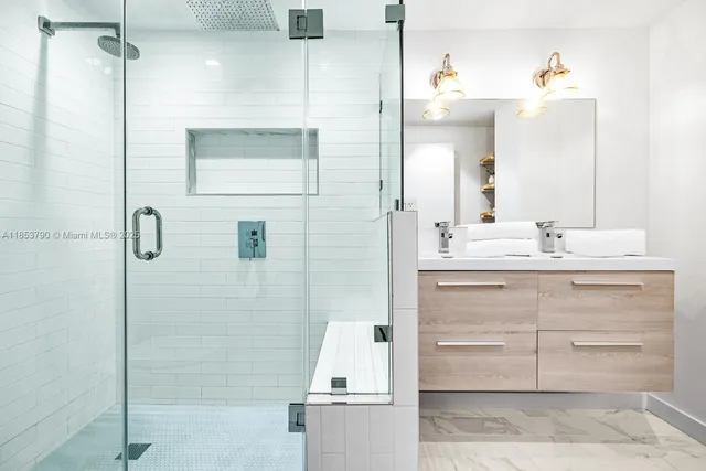 a view of an empty room with closet and a window