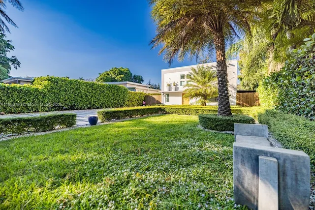 a bedroom with a bed and chandelier