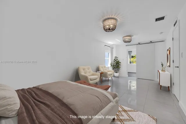 a kitchen with stainless steel appliances granite countertop a refrigerator sink and stove