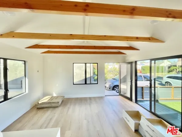 a view of a living room and wooden floor