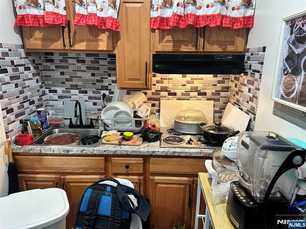 267 Ellison Street Paterson, NJ 07501 - Photo 15 of 16 a bathroom with a sink and a vanity