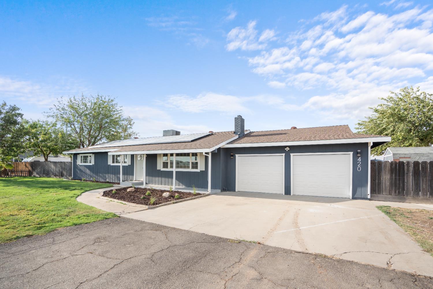 420 Bellevue Road Merced, CA 95348 - Photo 4 of 75 a front view of a house with garden