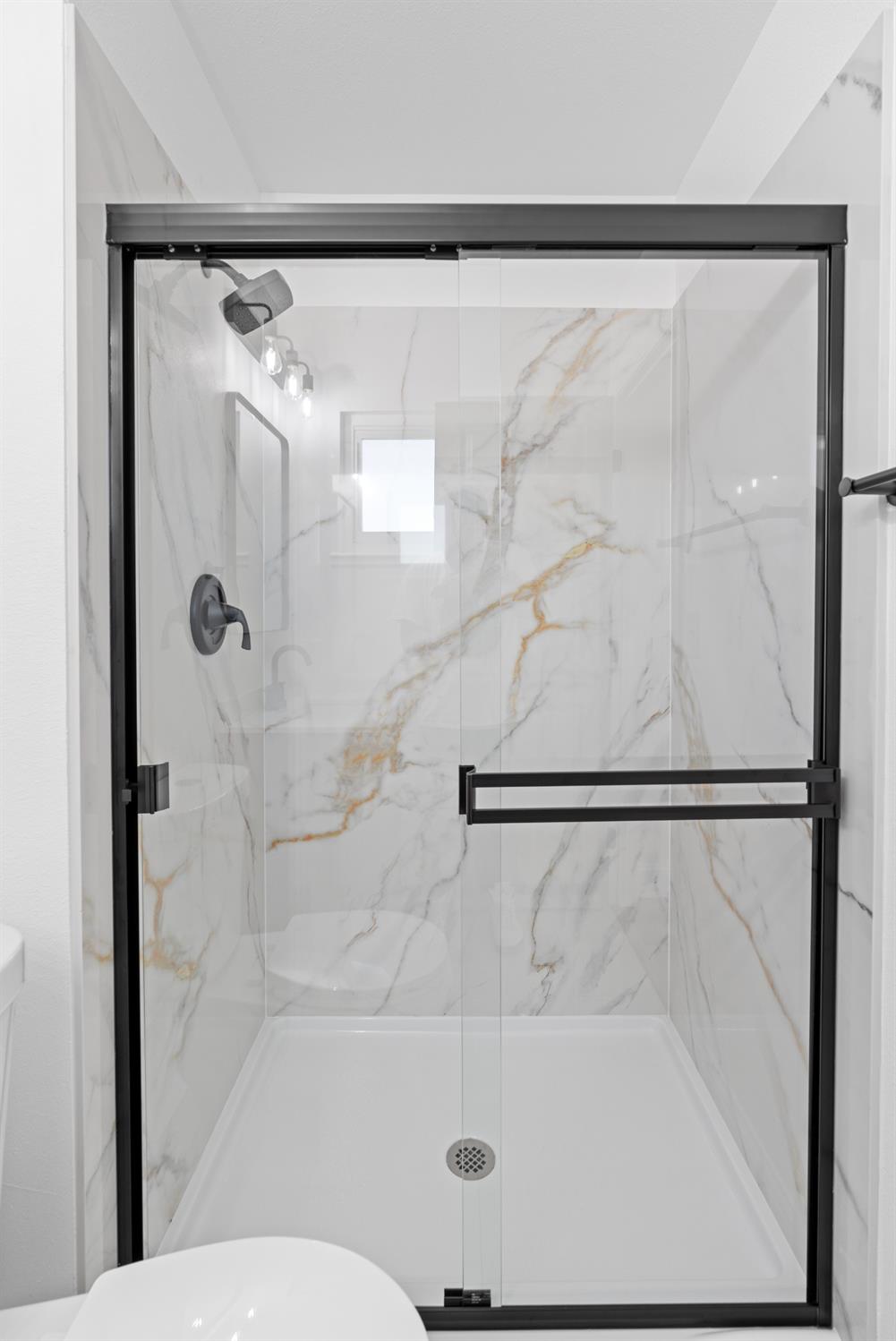 420 Bellevue Road Merced, CA 95348 - Photo 43 of 75 a bathroom with a shower and a glass door