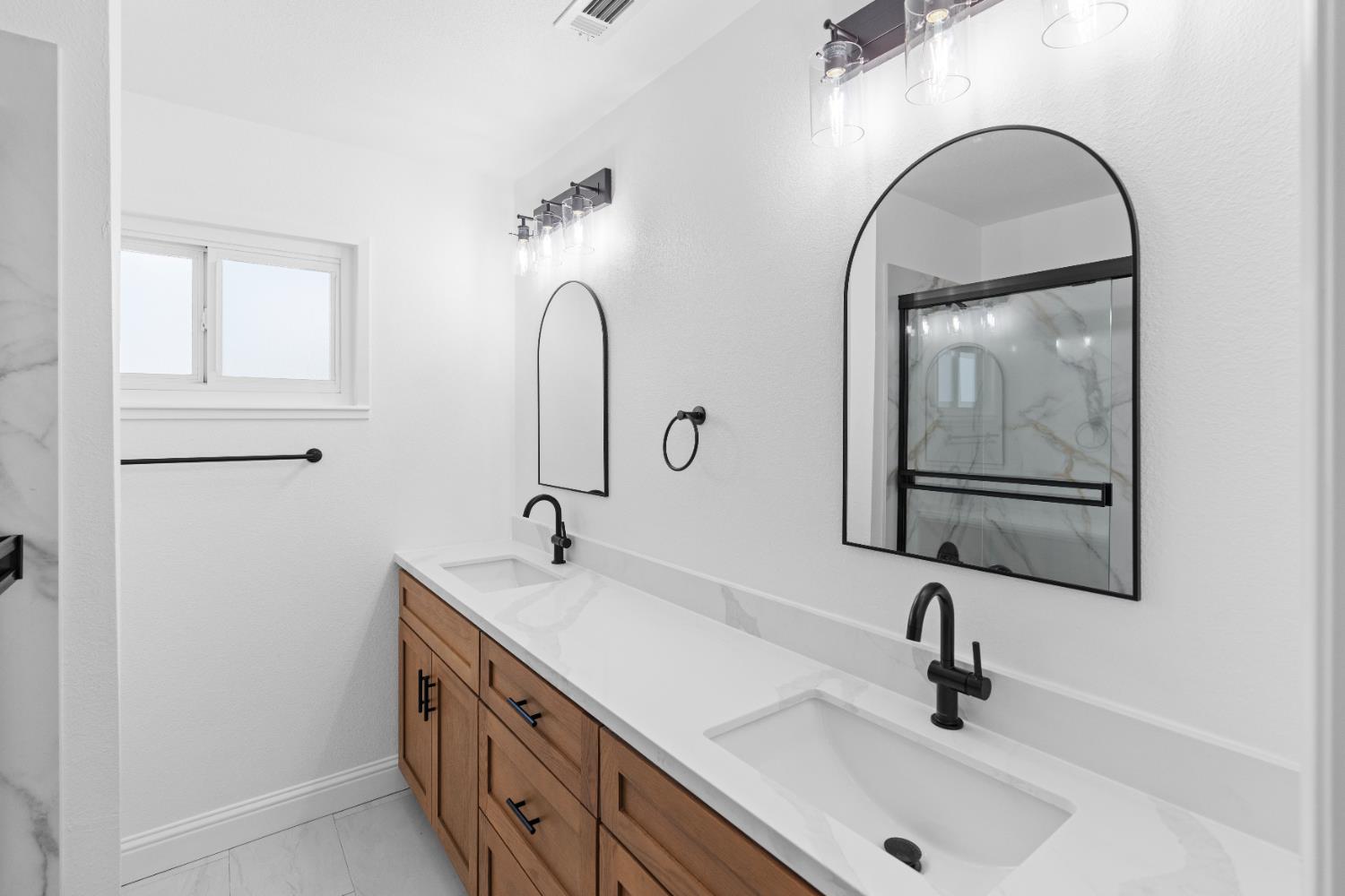 420 Bellevue Road Merced, CA 95348 - Photo 54 of 75 a bathroom with a sink and a mirror