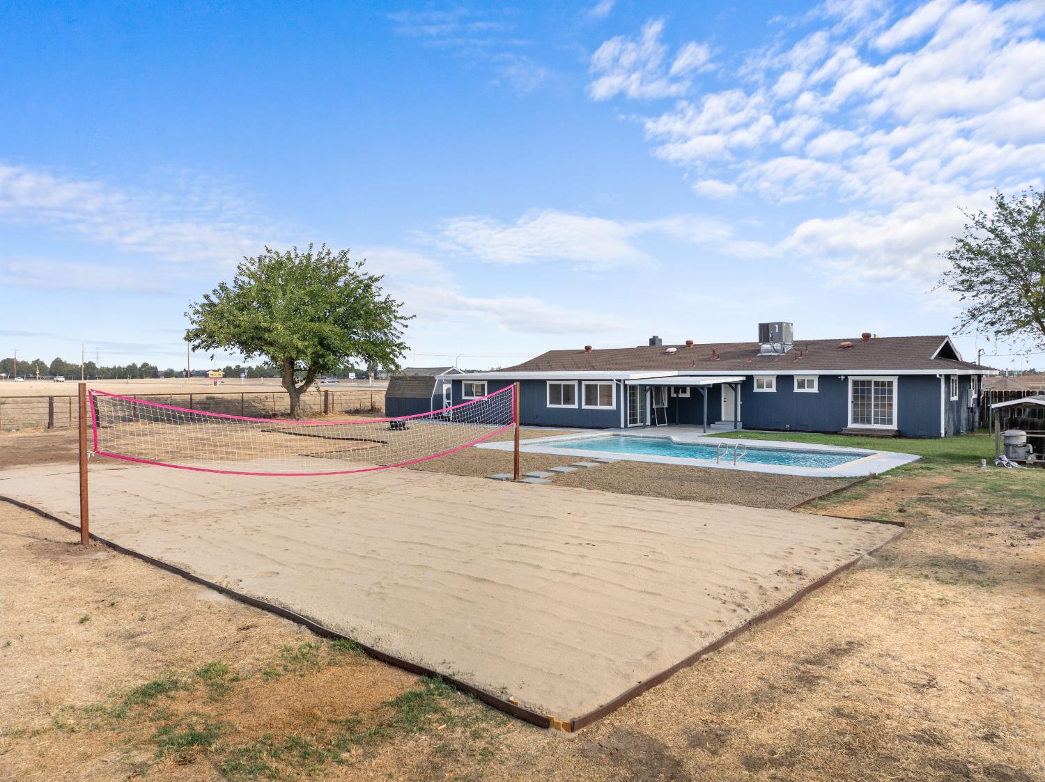 420 Bellevue Road Merced, CA 95348 - Photo 65 of 75 a view of swimming pool with outdoor seating and yard in back