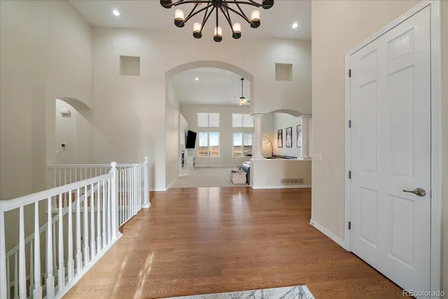 a view of a living room and chandelier