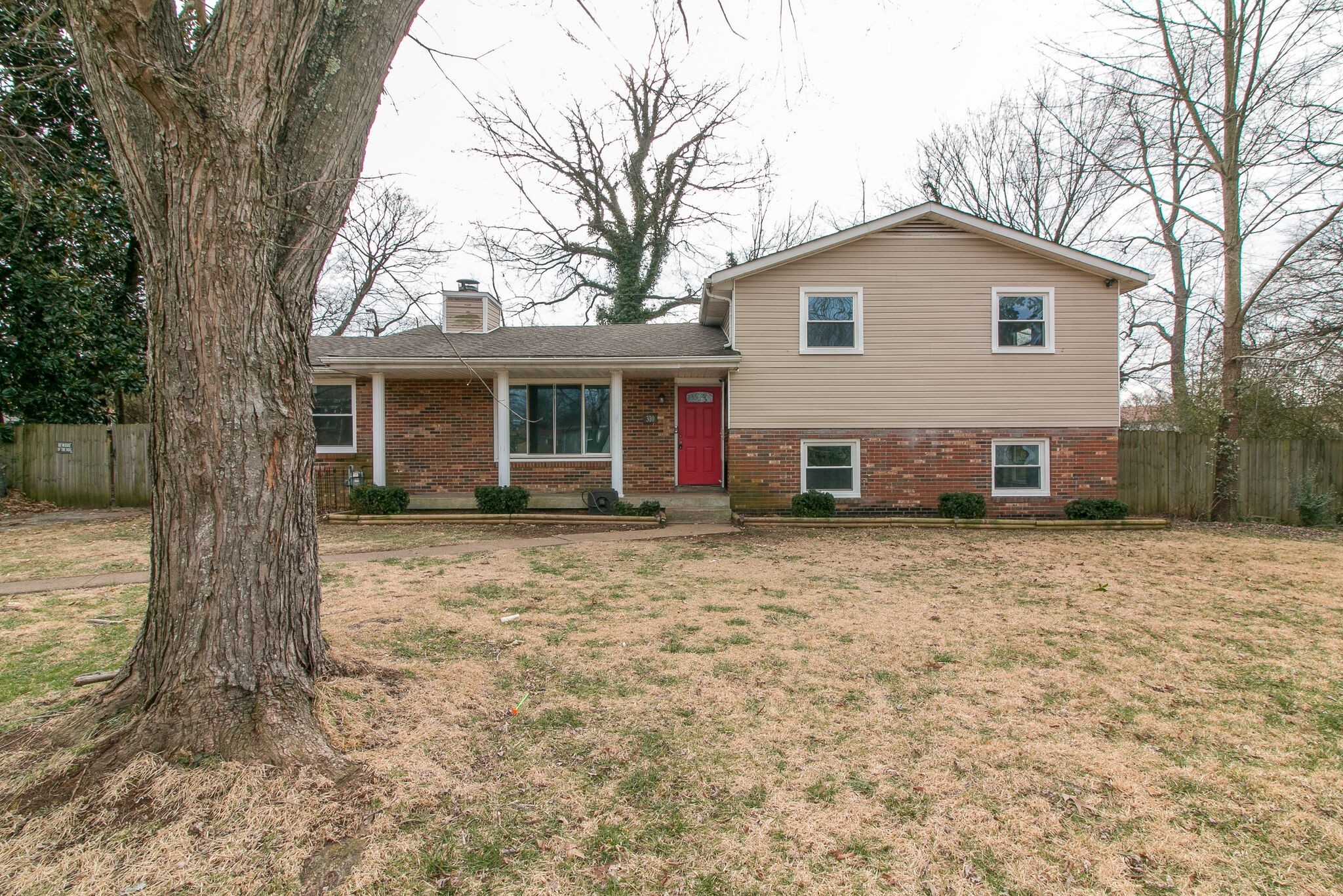 310 Burch Road Clarksville, TN 37042 - Photo 1 of 30 a view of a house with a yard covered in snow