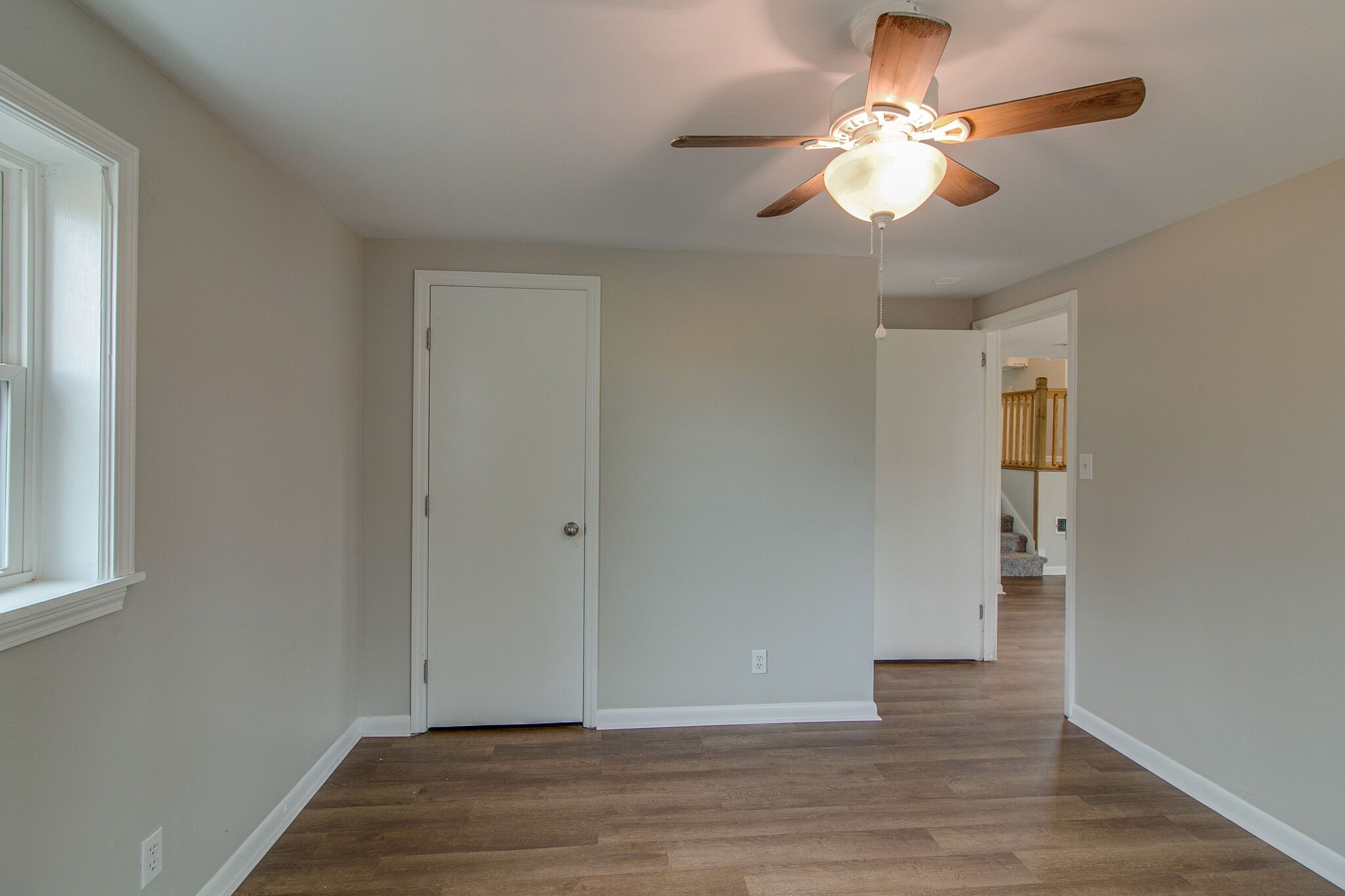 310 Burch Road Clarksville, TN 37042 - Photo 18 of 30 wooden floor in an empty room with a window