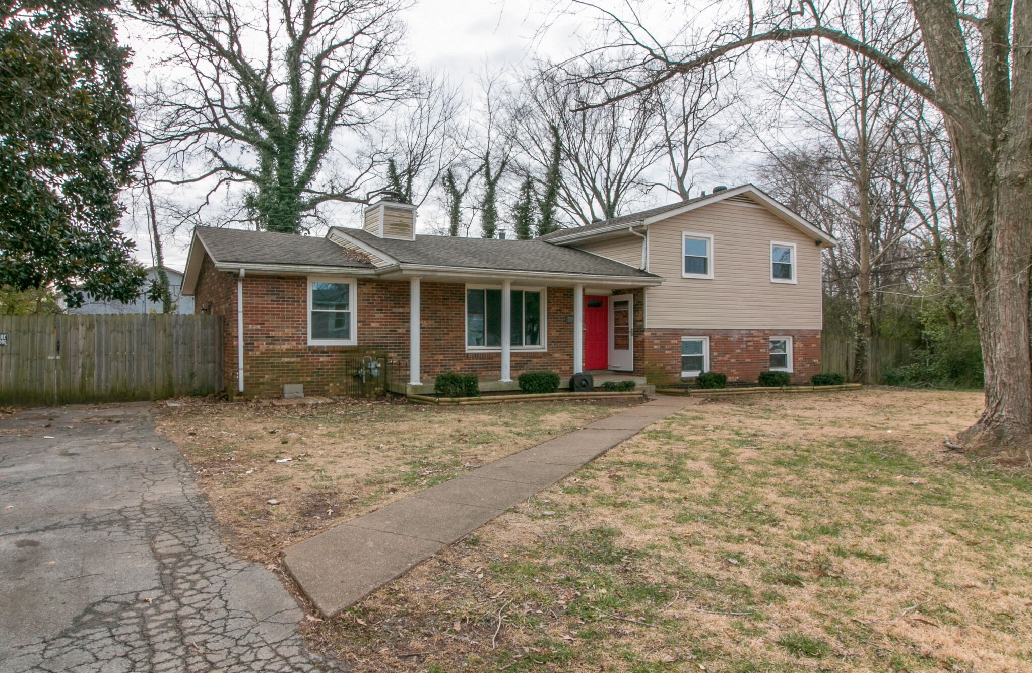 310 Burch Road Clarksville, TN 37042 - Photo 3 of 30 a view of a yard in front of a house with large tree