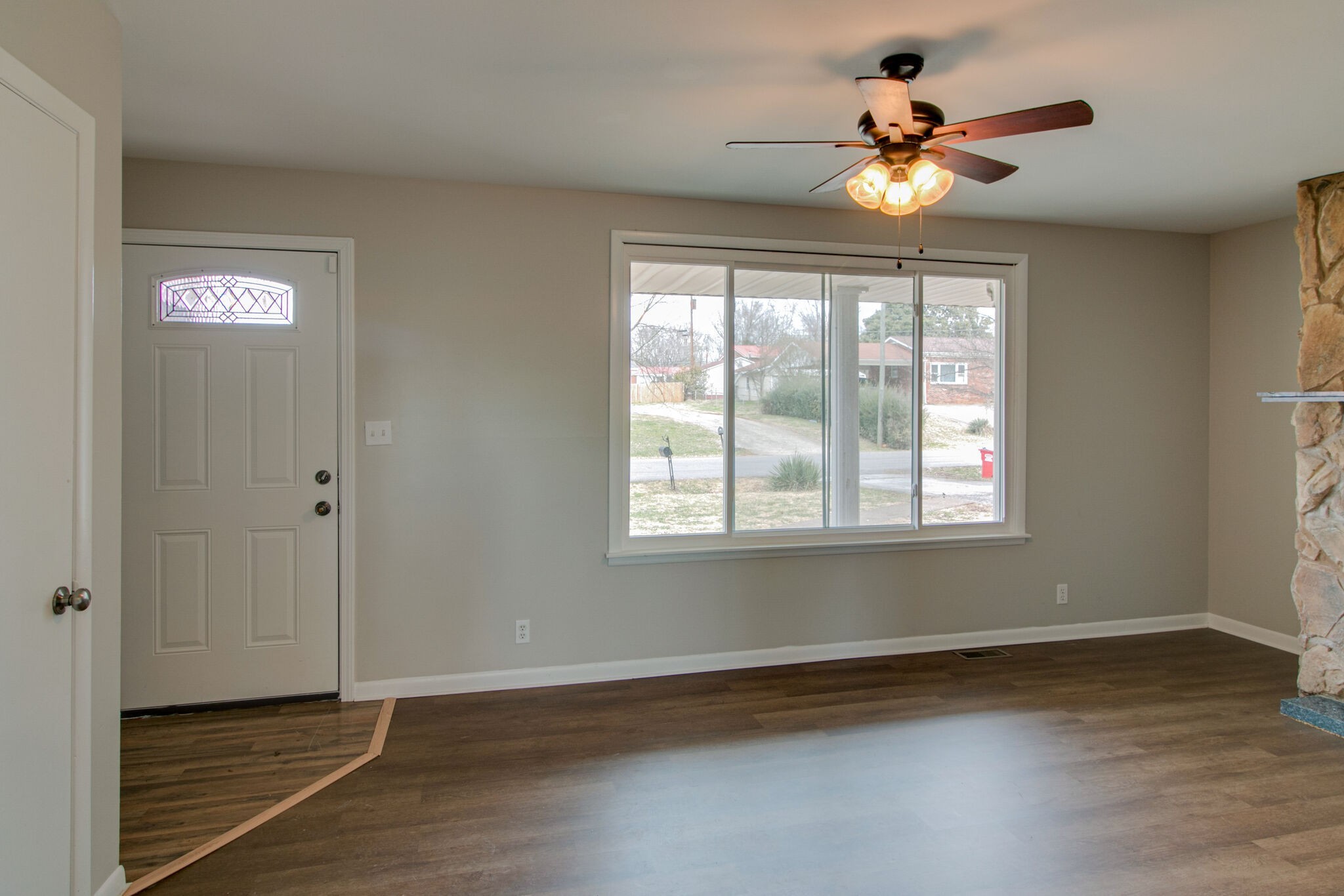 310 Burch Road Clarksville, TN 37042 - Photo 7 of 30 a view of an empty room with wooden floor and a window