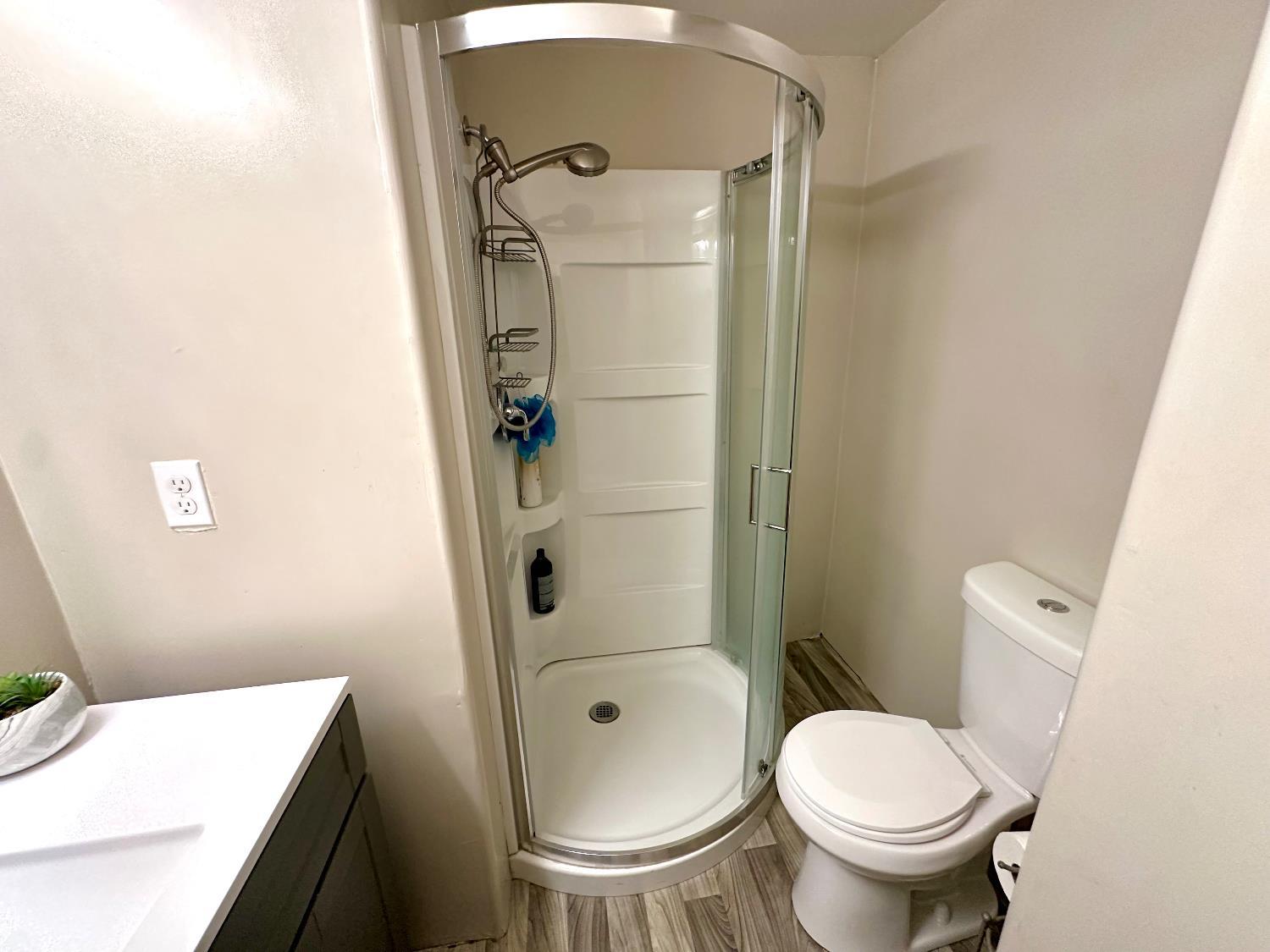 3435 Marfargoa Road, Unit 74 Stockton, CA 95215 - Photo 9 of 21 a bathroom with a toilet and a shower