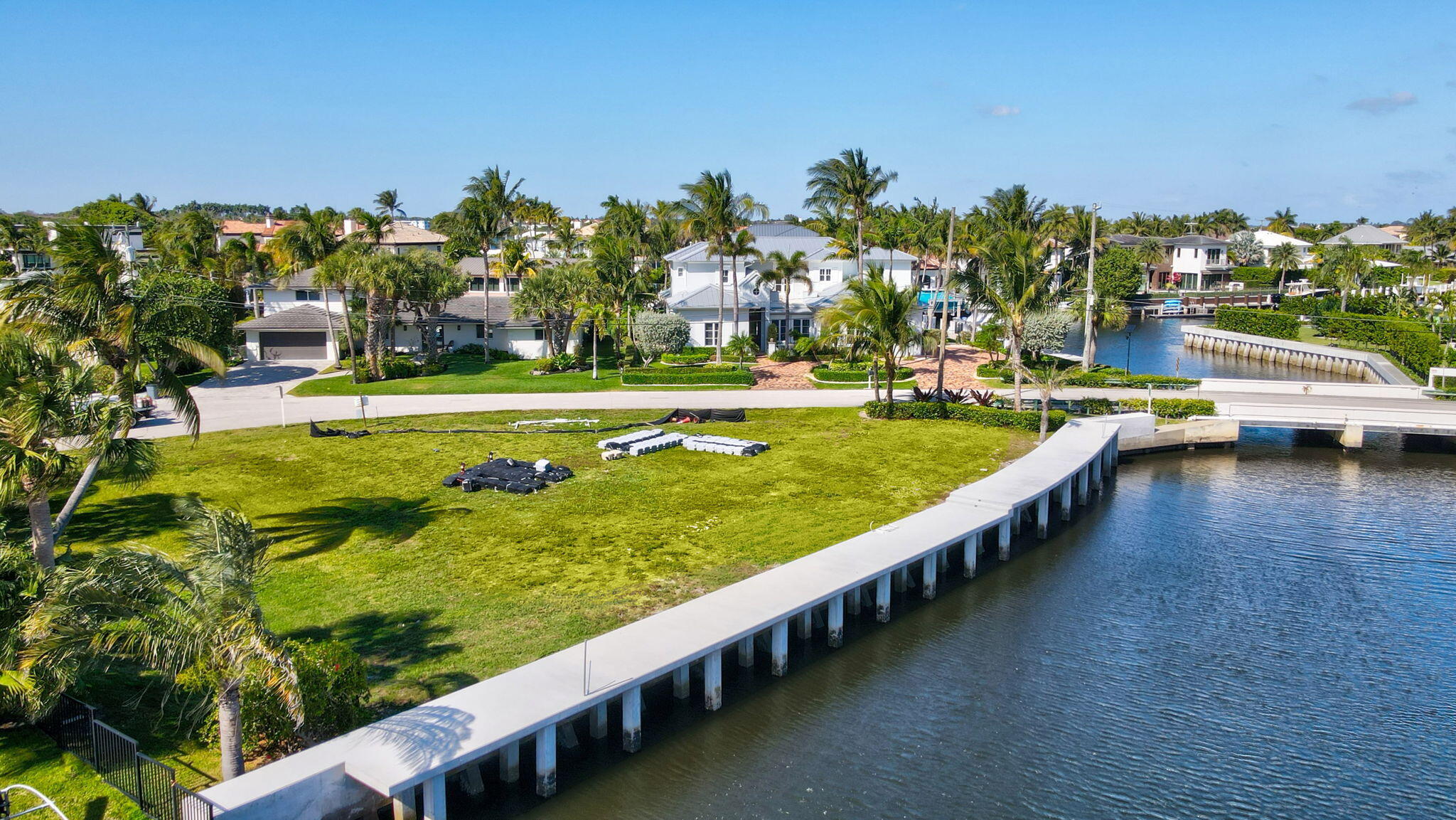 25 Sabal Island Drive Ocean Ridge, FL 33435 - Photo 16 of 16 a view of a swimming pool with lawn chairs
