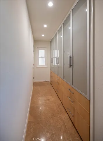 a view of hallway with a large mirror