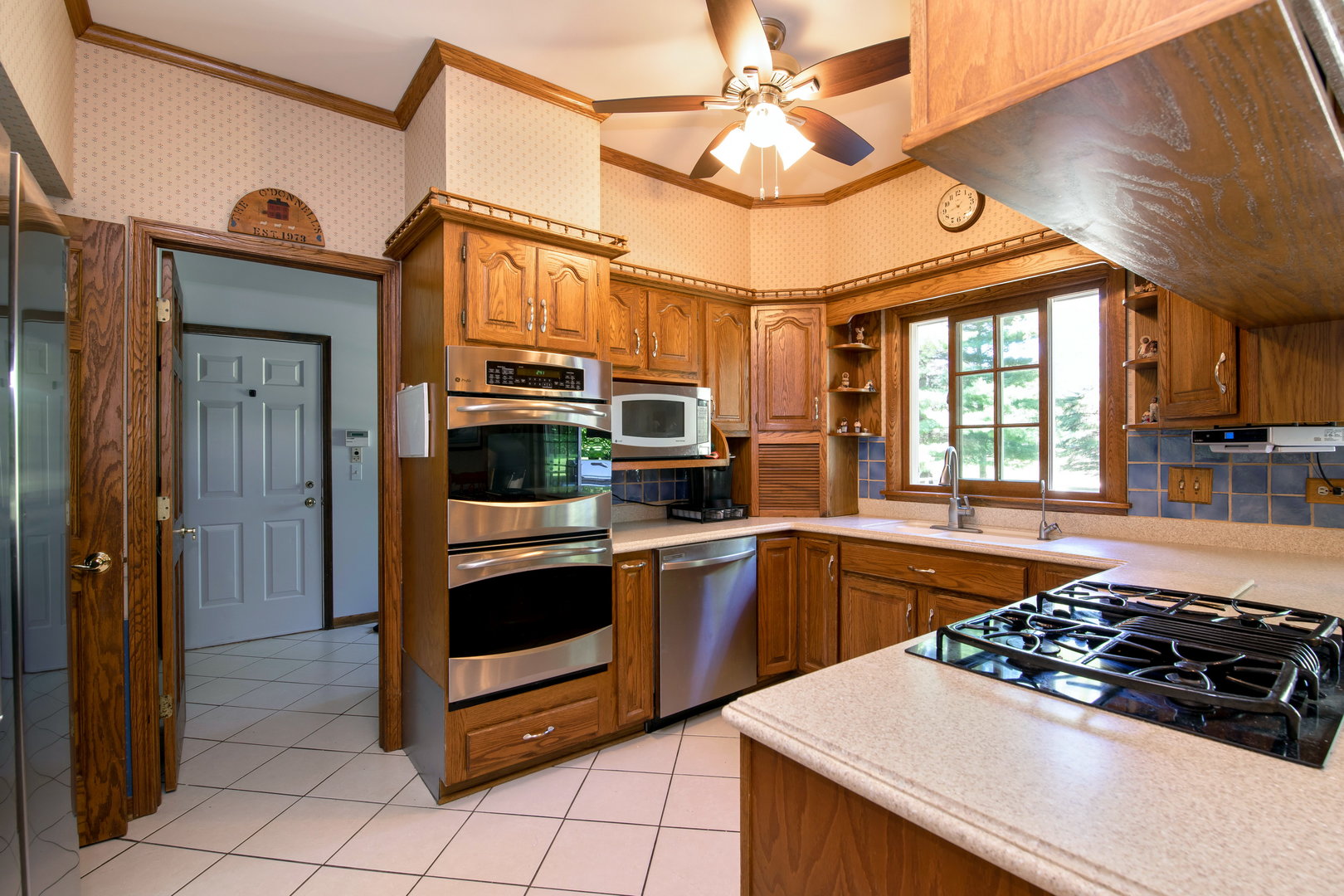 1 Cross Timber Road Barrington, IL 60010 - Photo 11 of 53 a kitchen with stainless steel appliances a stove a sink and a refrigerator