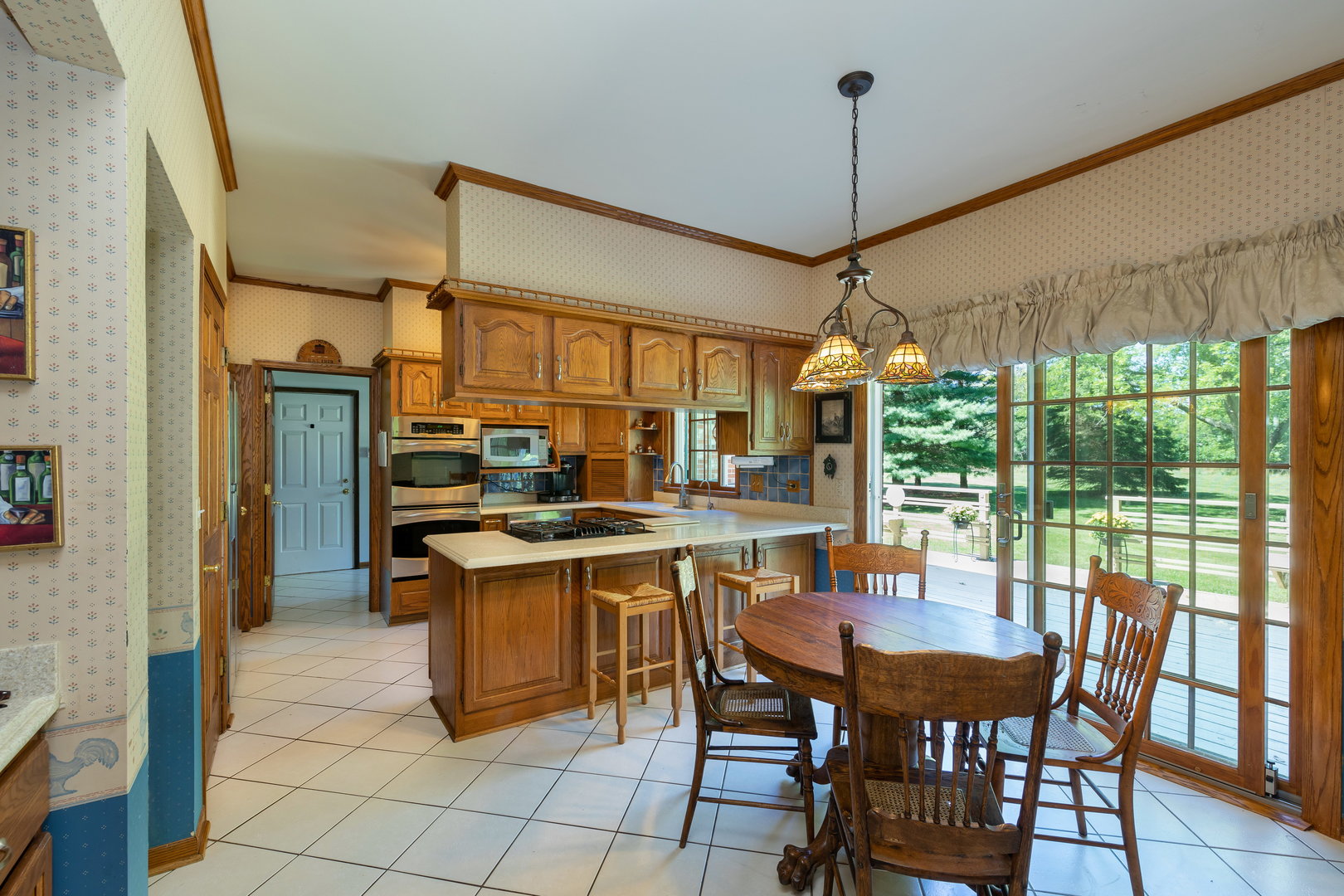 1 Cross Timber Road Barrington, IL 60010 - Photo 12 of 53 a view of a dining room with furniture window and outside view