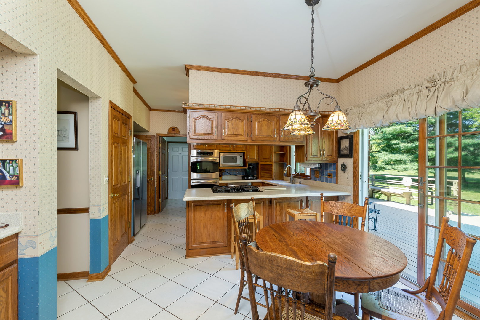 1 Cross Timber Road Barrington, IL 60010 - Photo 13 of 53 a kitchen with stainless steel appliances granite countertop a sink and a refrigerator