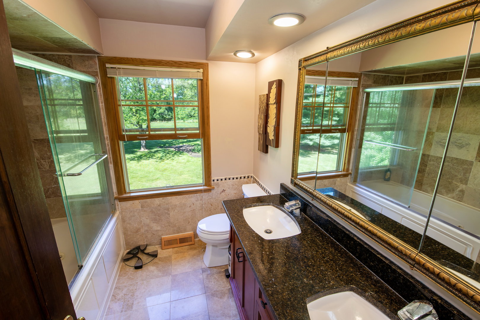 1 Cross Timber Road Barrington, IL 60010 - Photo 32 of 53 a bathroom with a granite countertop sink and mirror