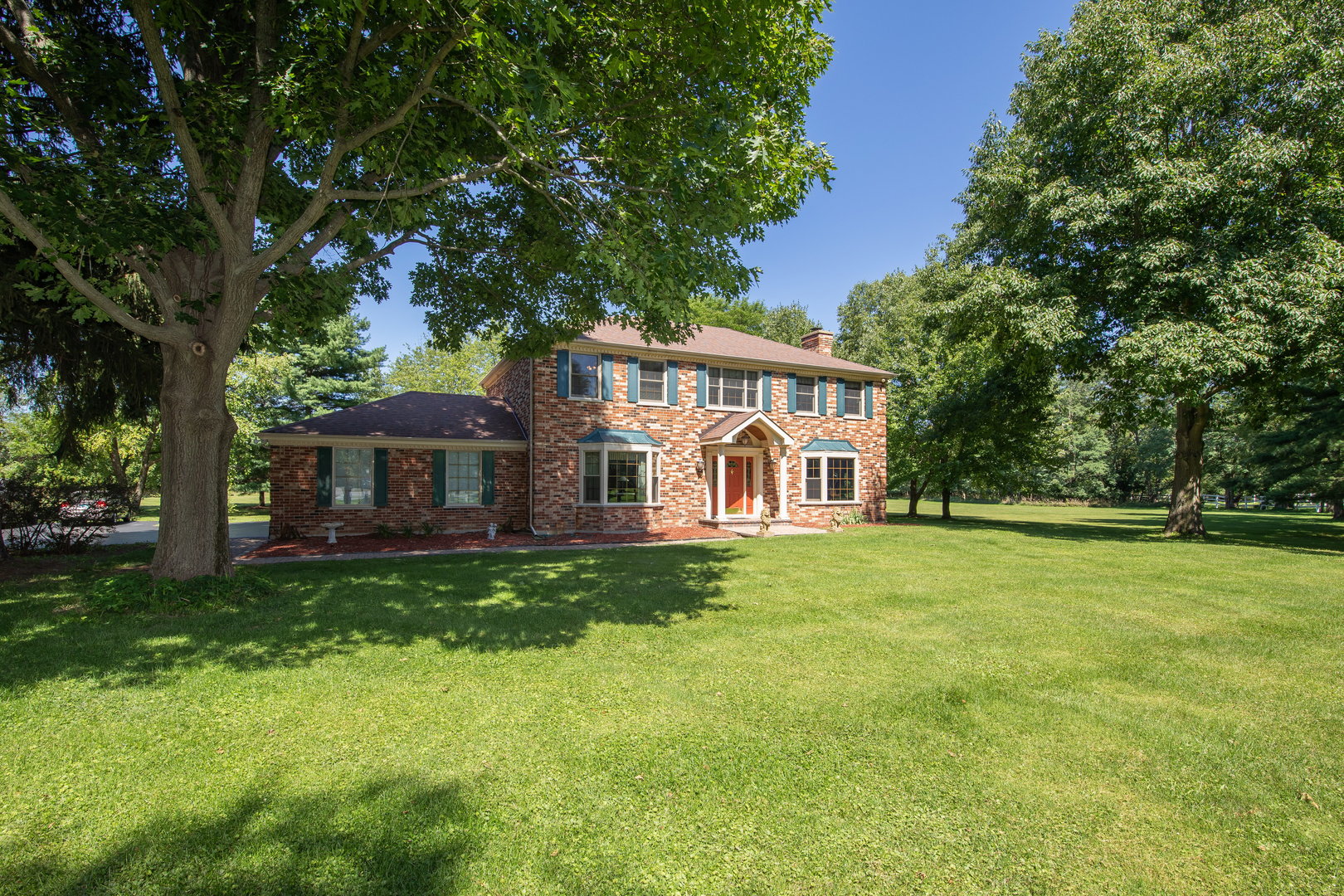 1 Cross Timber Road Barrington, IL 60010 - Photo 5 of 53 a front view of a house with a garden