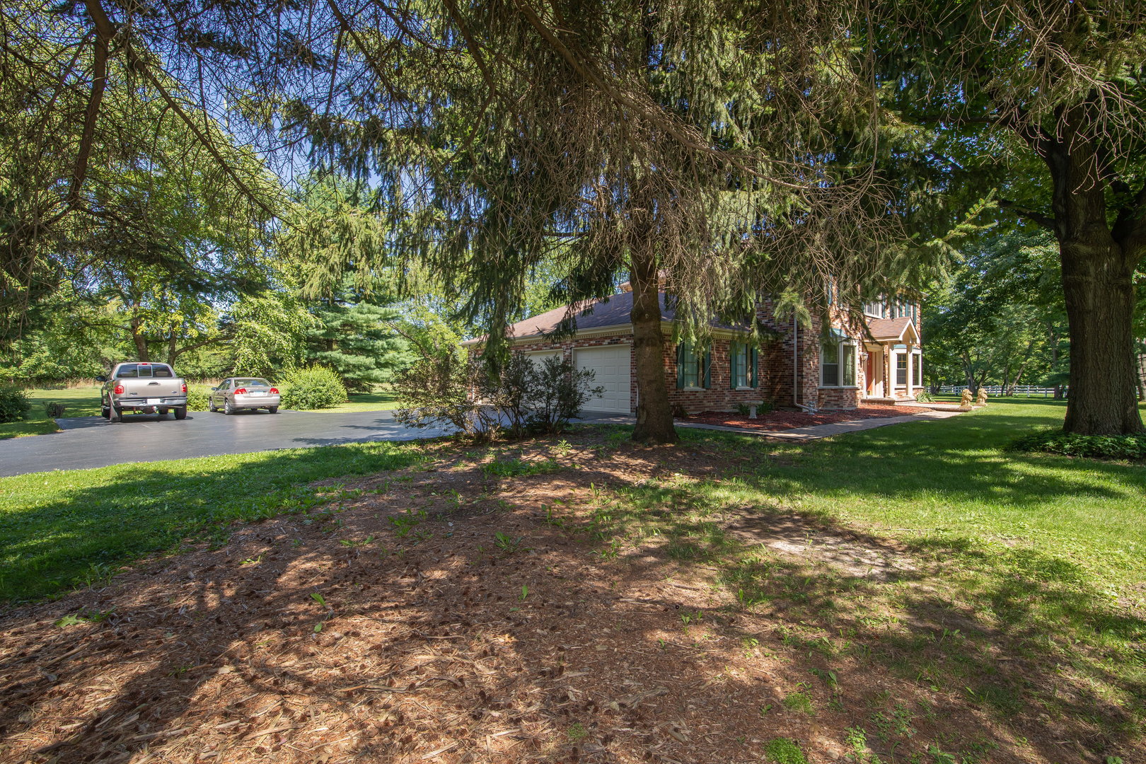 1 Cross Timber Road Barrington, IL 60010 - Photo 6 of 53 a view of a tree in front of a house