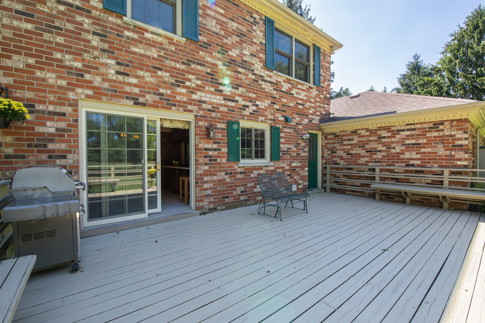 1 Cross Timber Road Barrington, IL 60010 - Photo 8 of 53 a view of a patio with table and chairs with wooden floor and fence