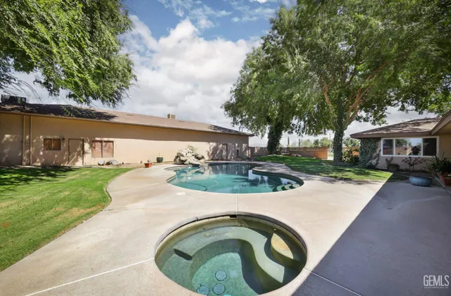 a view of swimming pool having outdoor seating