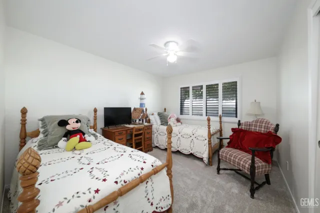 a bed room with two beds and a couch