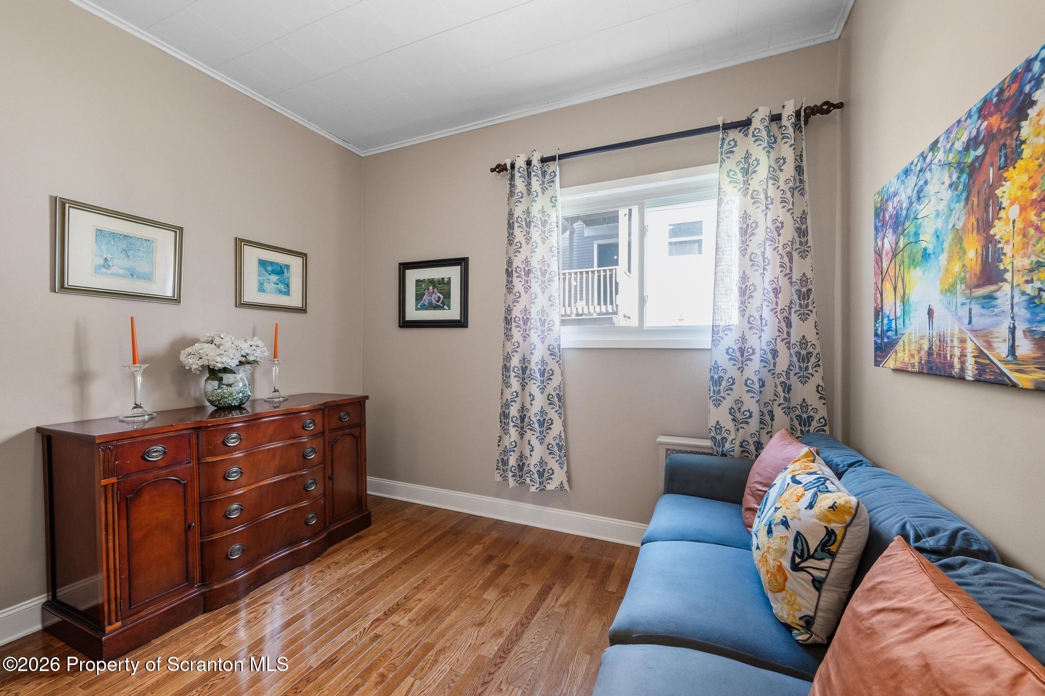 616 Myrtle Street Scranton, PA 18510 - Photo 18 of 65 a living room with furniture and a baby crib