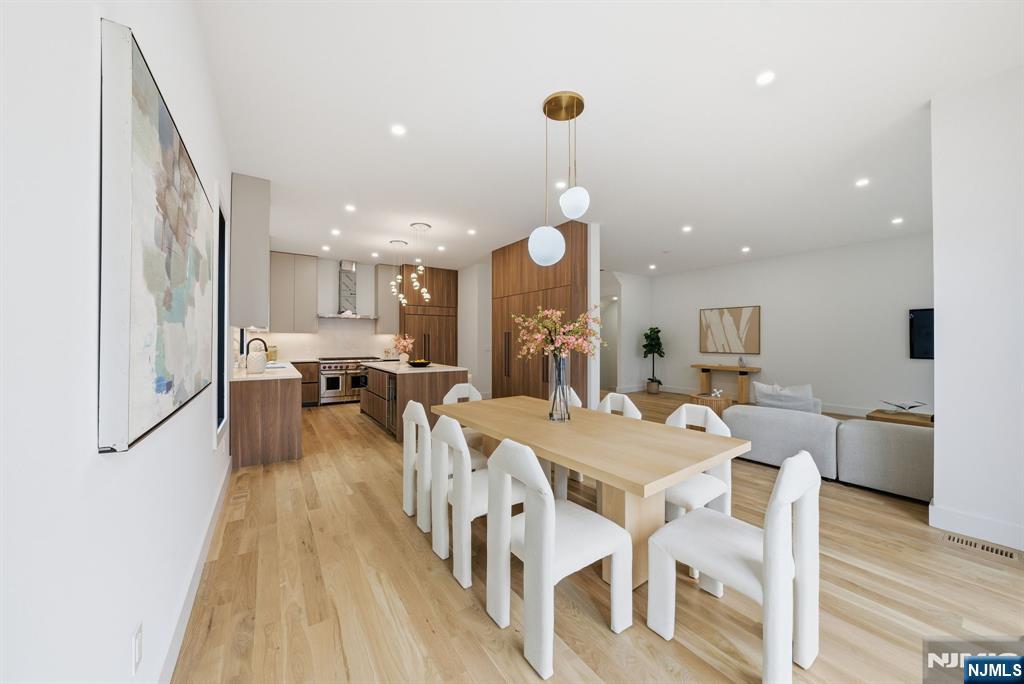 3 Cedar Court Demarest, NJ 07627 - Photo 21 of 49 a large kitchen with a table and chairs