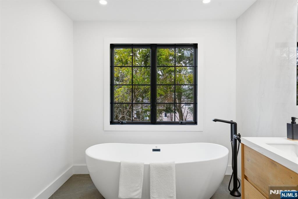 3 Cedar Court Demarest, NJ 07627 - Photo 38 of 49 a white bath tub sitting next to a white sink