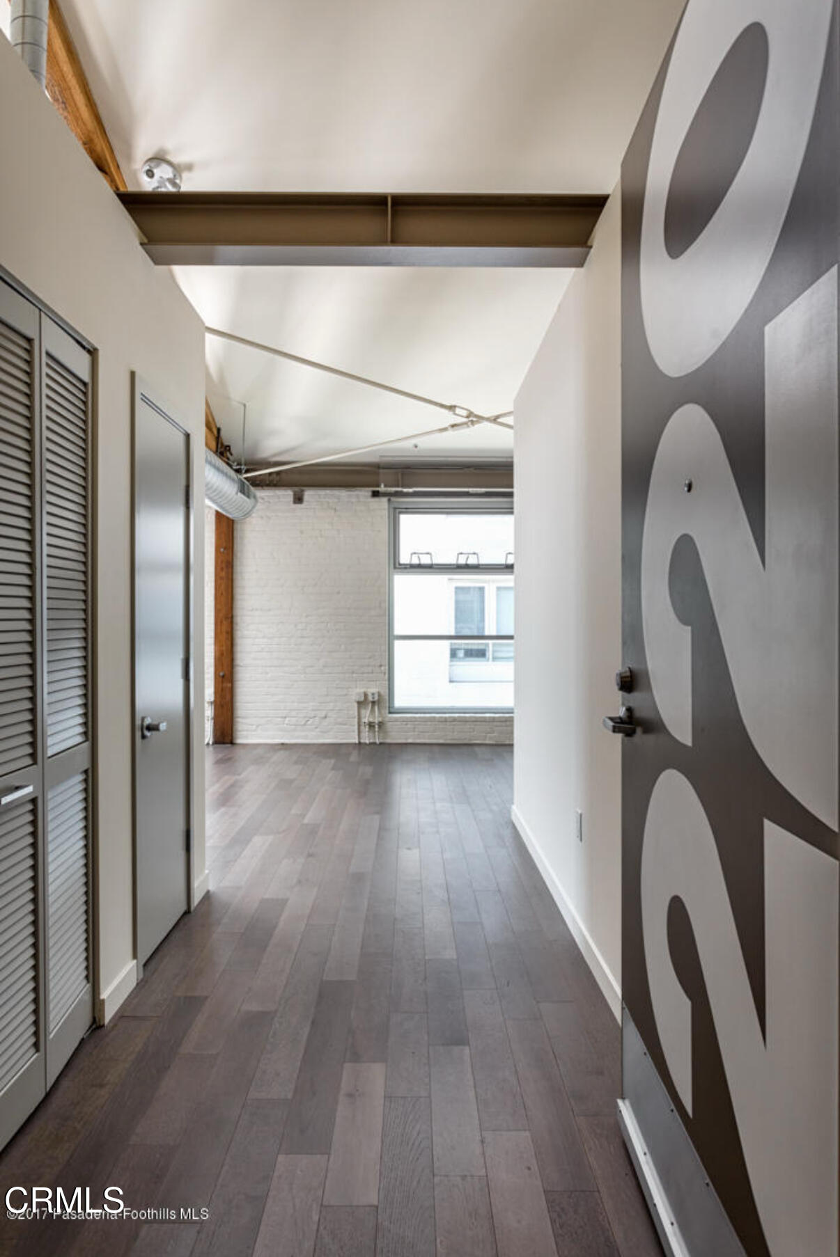 527 Molino Street, Unit 220 Los Angeles, CA 90013 - Photo 2 of 13 a view of a room with wooden floor