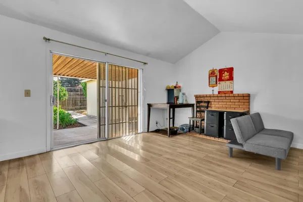 a bedroom with furniture and a wooden floor