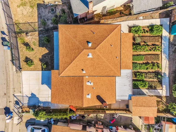 an aerial view of a house with a ocean view