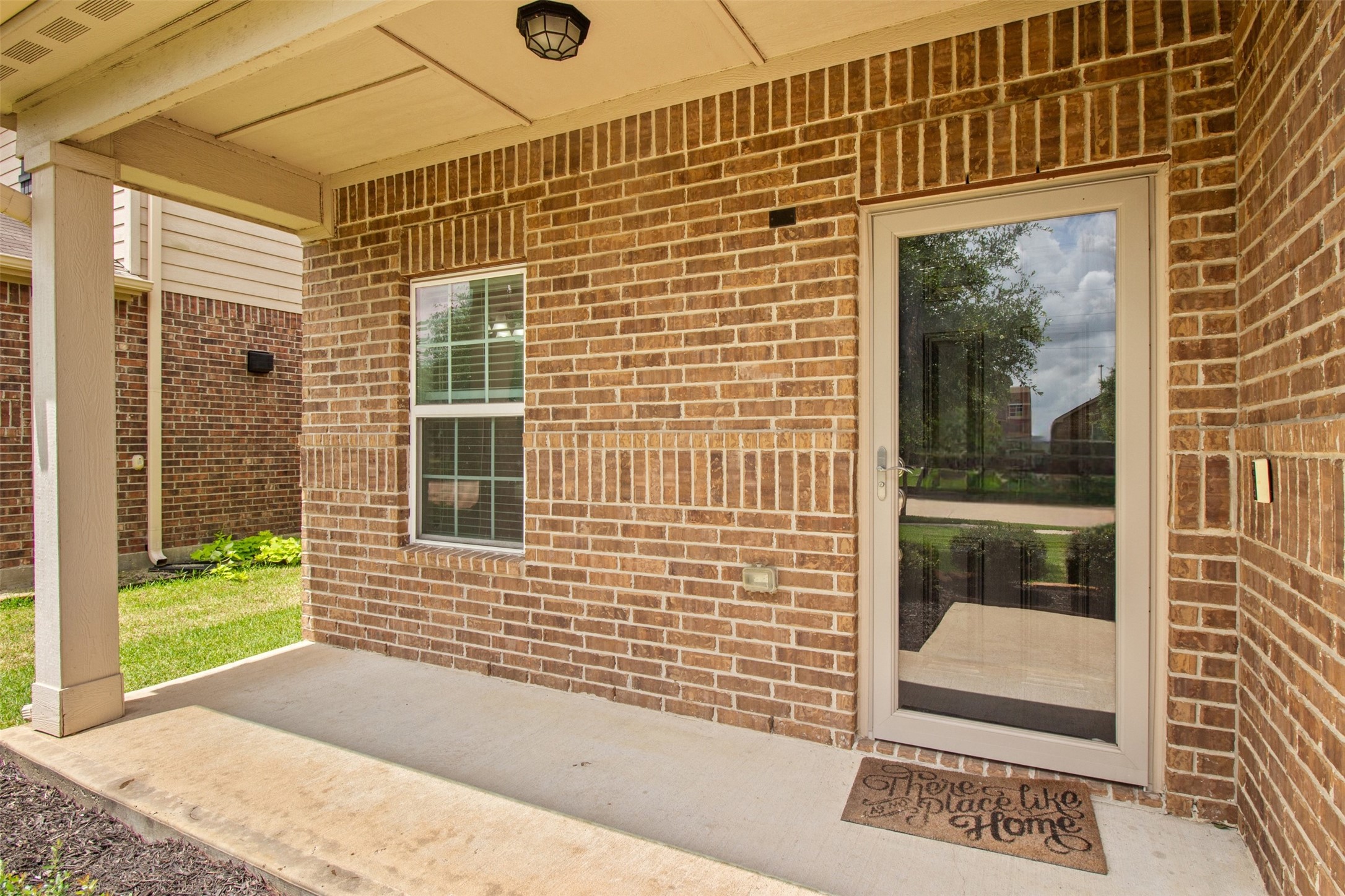 9426 Grand Spark Drive Rosharon, TX 77583 - Photo 2 of 31 The charming covered front porch provides a welcoming spot to enjoy your morning coffee or unwind after a long day. The entry adds both character and functionality while creating a comfortable transition into the home.