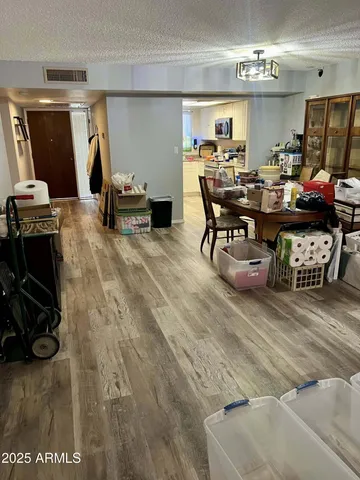 a kitchen with stainless steel appliances granite countertop a stove a sink dishwasher and a refrigerator