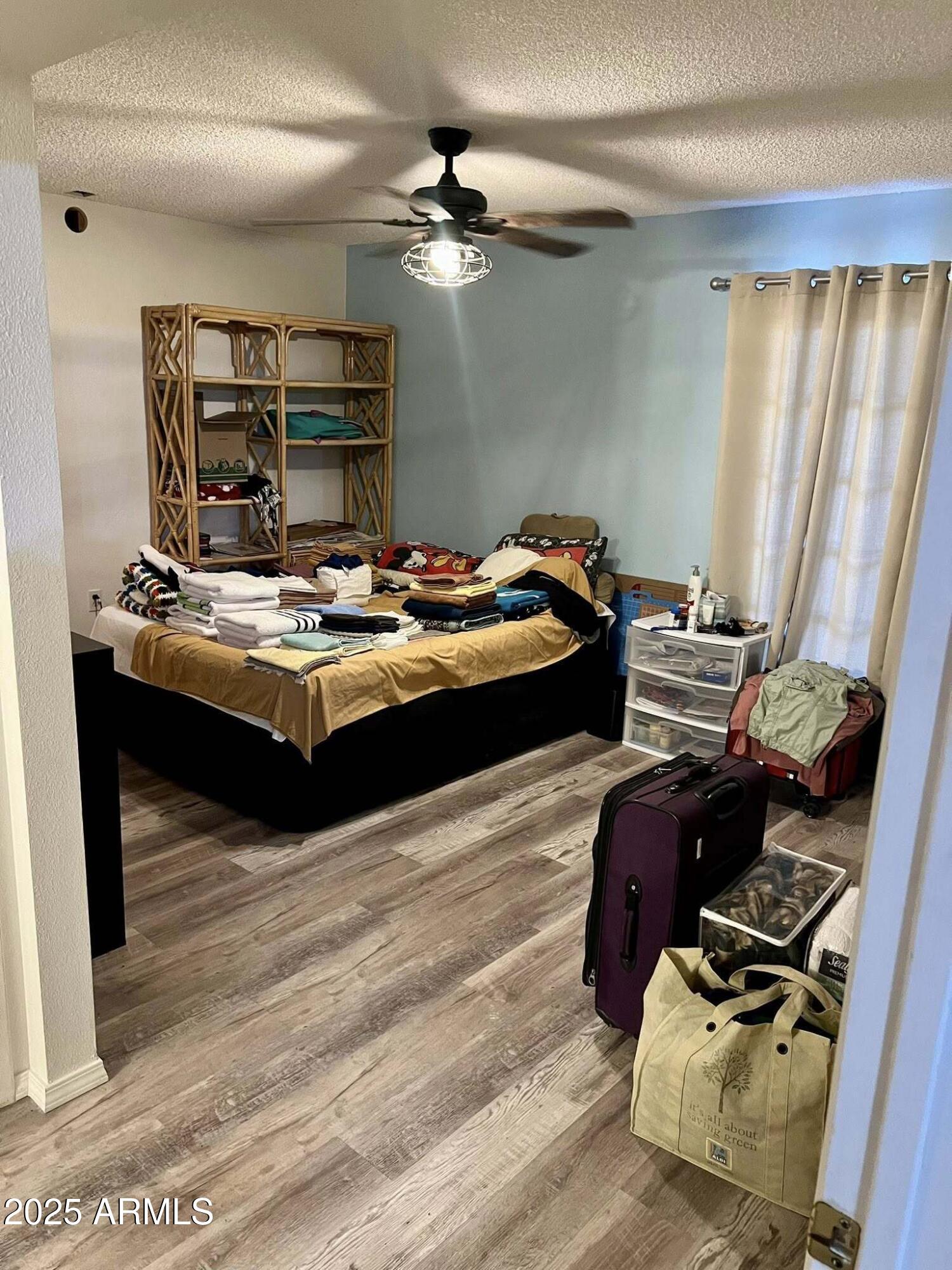 709 South Power Road, Unit 107 Mesa, AZ 85206 - Photo 15 of 26 a room with furniture and chandelier