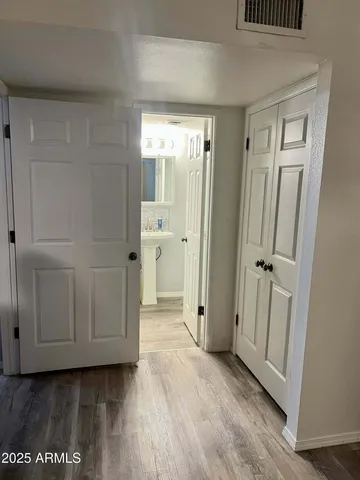 a bedroom with a bed and a television