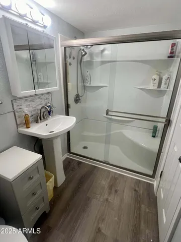 a white toilet sitting next to a bathroom sink
