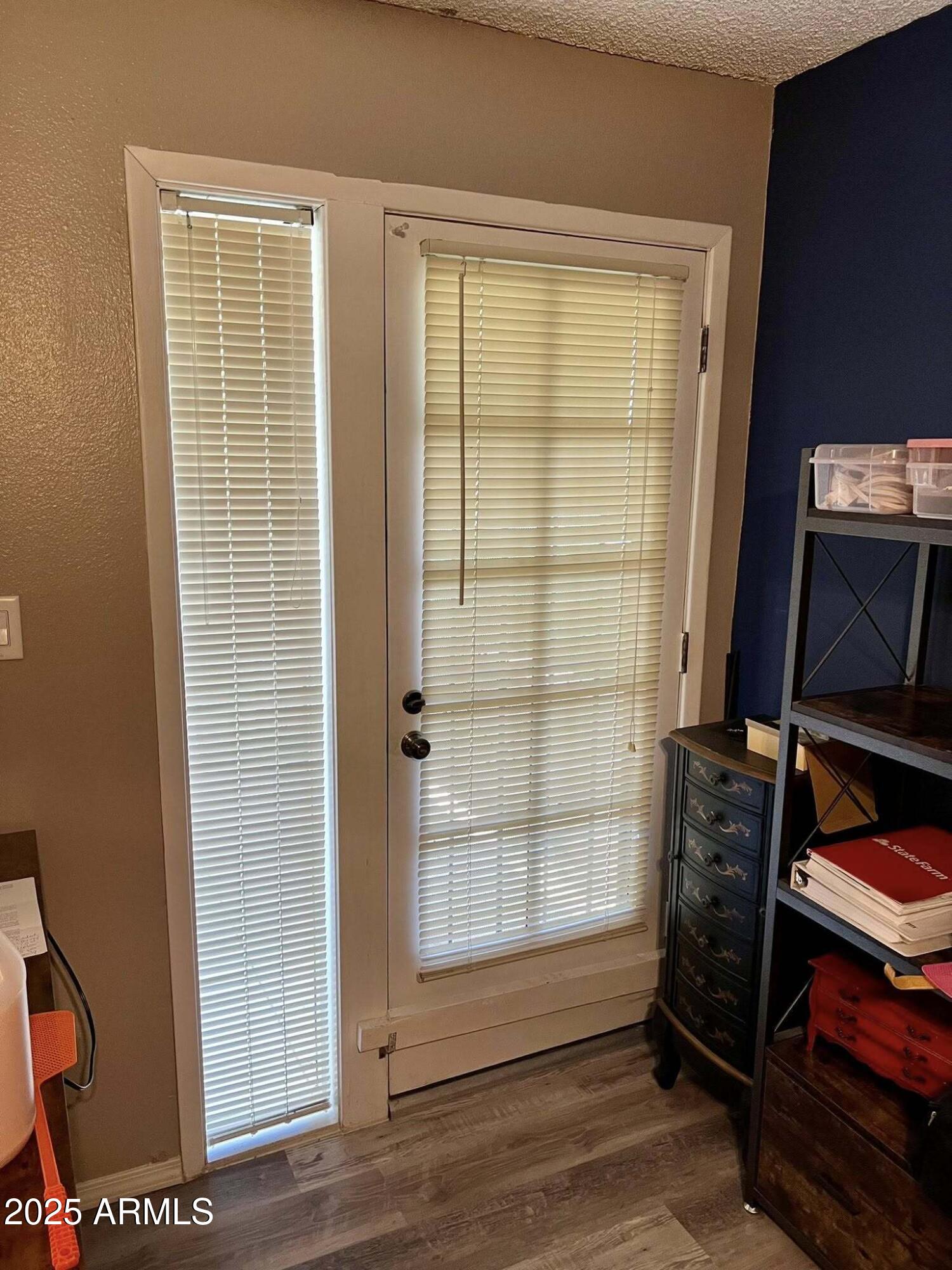 709 South Power Road, Unit 107 Mesa, AZ 85206 - Photo 21 of 26 a view of walk in closet with clothes and shoes