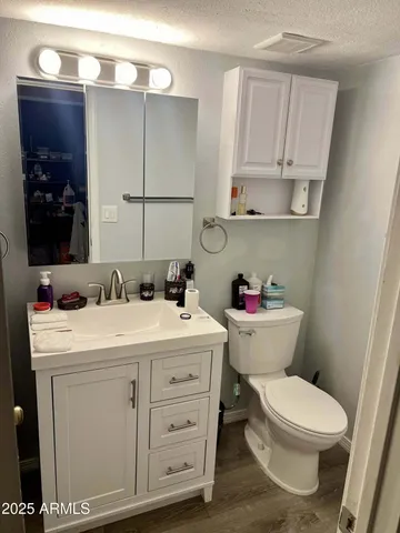 a view of a gallery with wooden floor