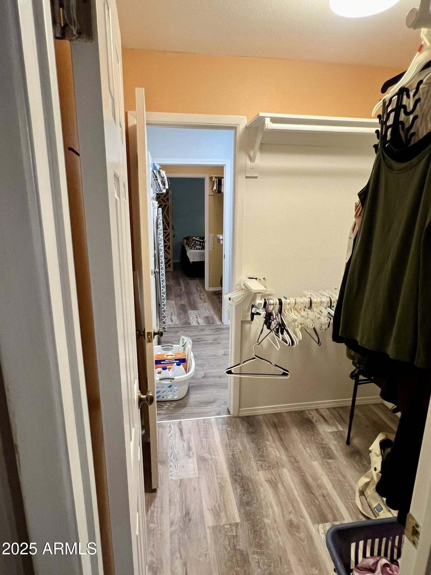 709 South Power Road, Unit 107 Mesa, AZ 85206 - Photo 23 of 26 a view of a gallery with wooden floor