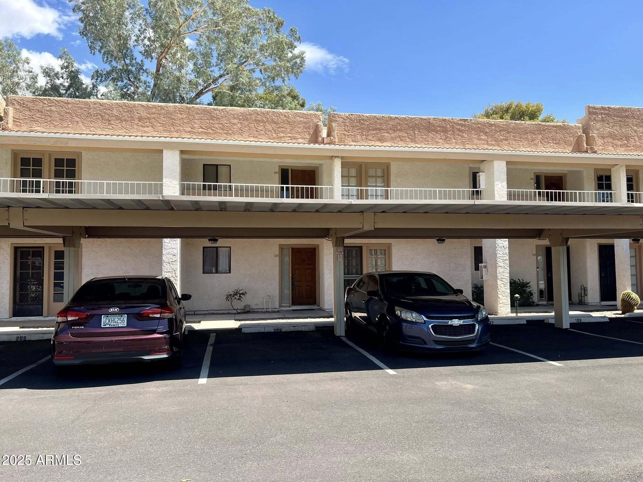 709 South Power Road, Unit 107 Mesa, AZ 85206 - Photo 4 of 26 a car parked in front of a building