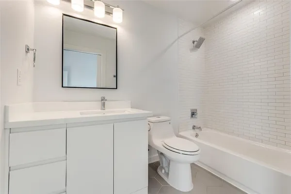 a bathroom with a toilet sink and a bathtub