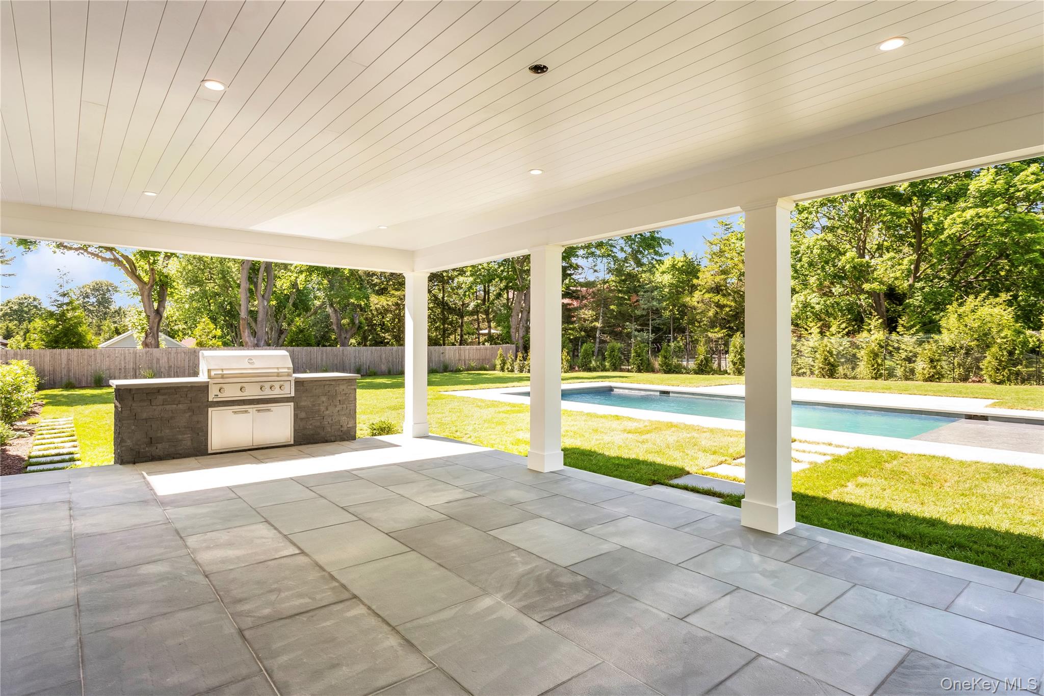 152 South Road Westhampton, NY 11977 - Photo 6 of 26 Covered Back Porch and Outdoor Kitchen