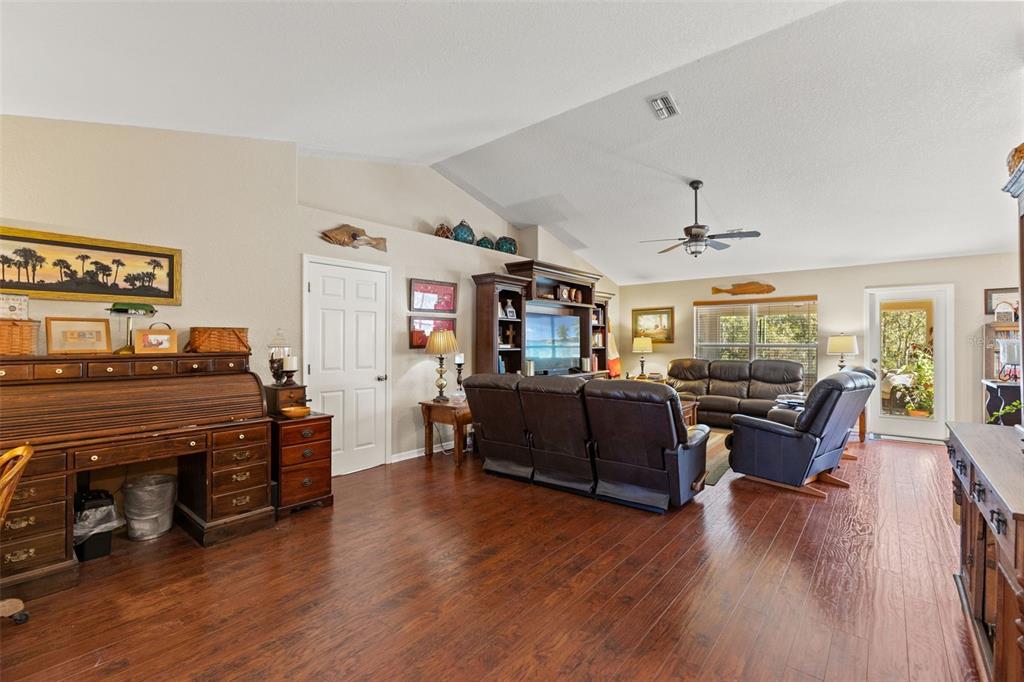 5 Boxleaf Court Homosassa, FL 34446 - Photo 12 of 58 a living room with furniture and a wooden floor